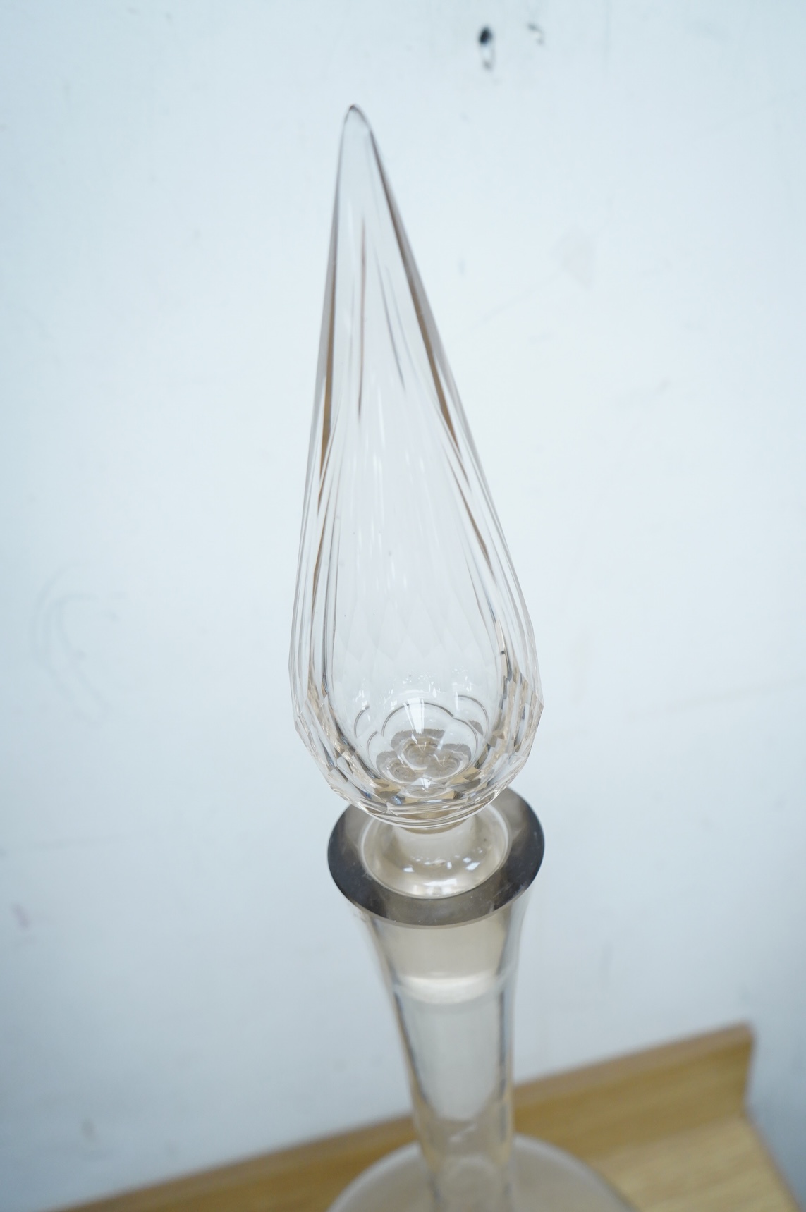 A pair of large clear glass chemist window display bottles and stoppers, one with chip, 90cm high